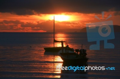 Sunrise And Boat Stock Photo