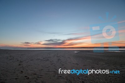 Sunrise Horizon Line On A Deserted Beach Stock Photo