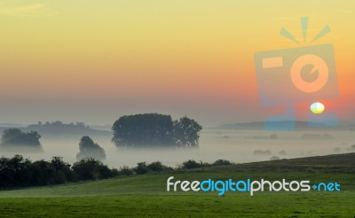 Sunrise In Countryside Stock Photo