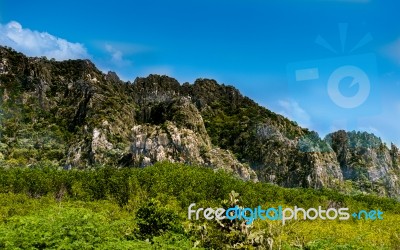 Sunrise Landscape Of Foggy And Cloudy Mountain Valley Stock Photo