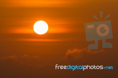 Sunrise Over Clouds With Bright Yellow Sun On A Morning Stock Photo