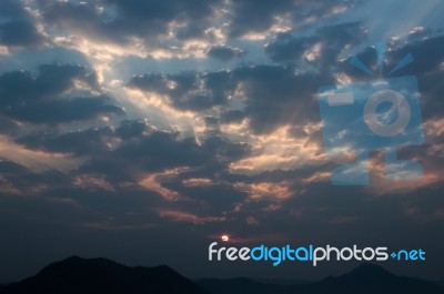 Sunrise Rays On Morning Blue Orange Sky Cloud With Mountain Stock Photo