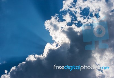 Sun's Rays Behind The Cloud Stock Photo