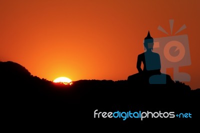 Sunset And Buddha Stock Photo