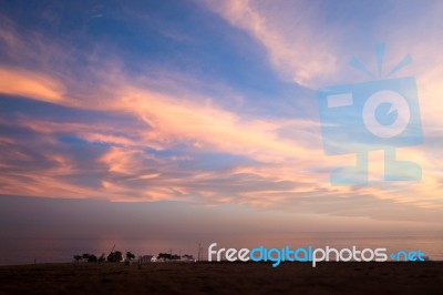 Sunset And Lost Property On The Pacific Coast Stock Photo