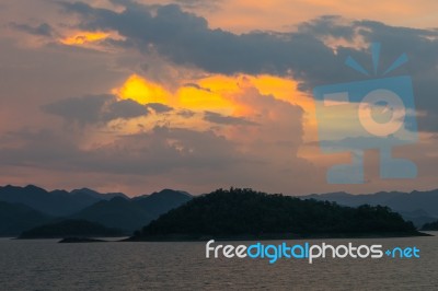 Sunset At Lake With Mountain Rage Stock Photo