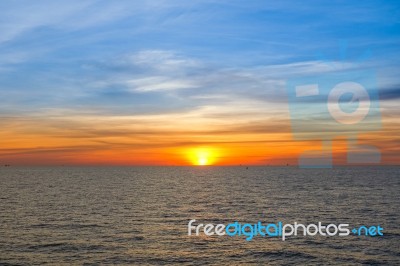 Sunset At Sea With Beautiful Clouds In The Evening And Twilight Stock Photo