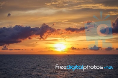 Sunset At Sea With Beautiful Clouds In The Evening And Twilight Stock Photo