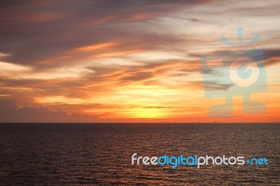 Sunset At Sea With Beautiful Clouds In The Evening And Twilight Stock Photo