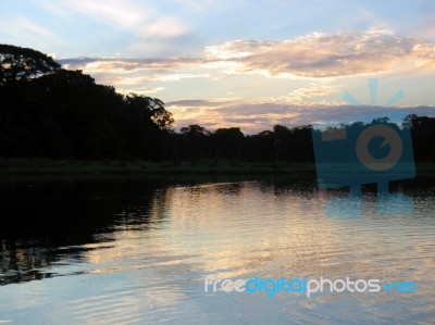 Sunset In The Amazon Stock Photo