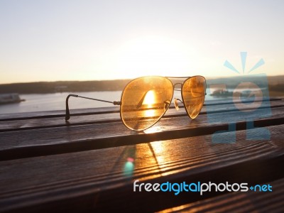 Sunset Light Thru The Glasses Lens Stock Photo