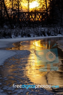 Sunset On The River In Winter Stock Photo