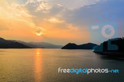 Sunset Over A Mountain At Lake Stock Photo