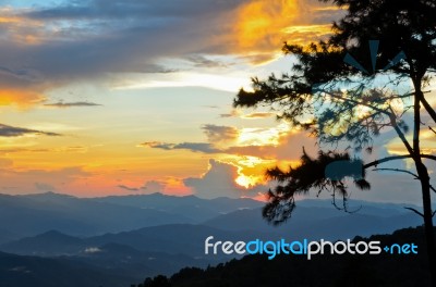 Sunset Over High Mountain Range Stock Photo