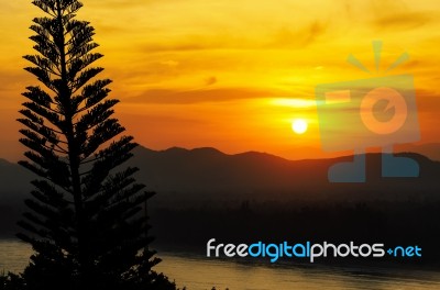 Sunset Over Mountain Range Stock Photo