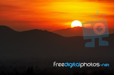 Sunset Over Mountain Range Stock Photo