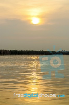 Sunset Reflect In Water Stock Photo