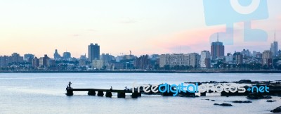 Sunset Scene Of Beach And Skyline At Background In Montevideo, U… Stock Photo