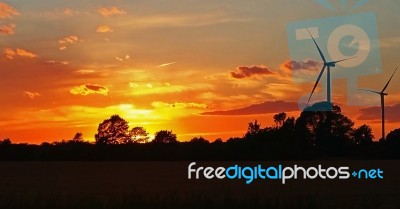 Sunset & Wind Turbines Stock Photo