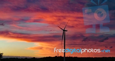 Sunset & Wind Turbines Stock Photo