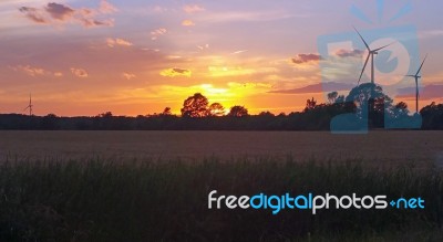 Sunset & Wind Turbines Stock Photo