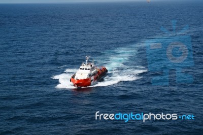 Supply Boat Transfer Cargo To Oil And Gas Industry Stock Photo