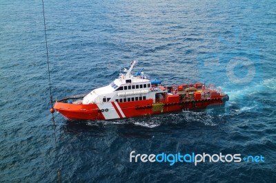 Supply Boat Transfer Cargo To Oil And Gas Industry Stock Photo