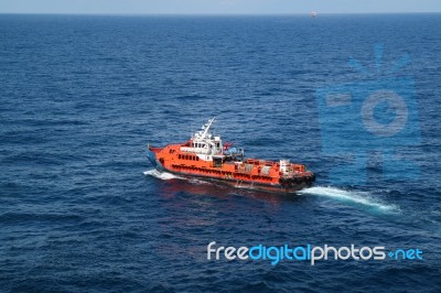 Supply Boat Transfer Cargo To Oil And Gas Industry Stock Photo