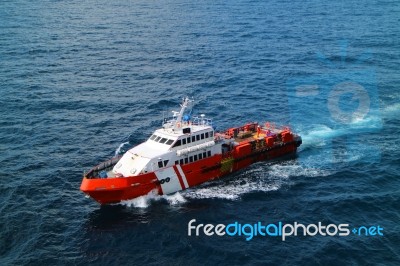 Supply Boat Transfer Cargo To Oil And Gas Industry Stock Photo