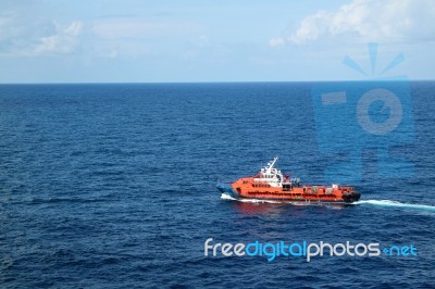 Supply Boat Transfer Cargo To Oil And Gas Industry Stock Photo