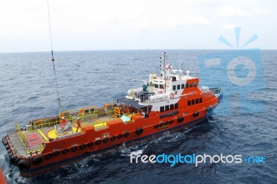 Supply Boat Transfer Cargo To Oil And Gas Industry Stock Photo