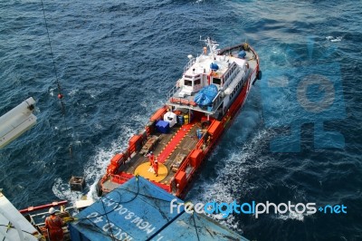 Supply Boat Transfer Cargo To Oil And Gas Industry Stock Photo