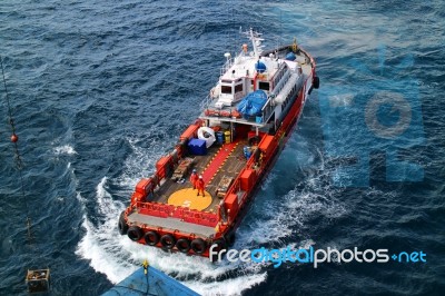 Supply Boat Transfer Cargo To Oil And Gas Industry Stock Photo