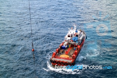 Supply Boat Transfer Cargo To Oil And Gas Industry Stock Photo