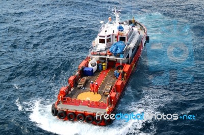 Supply Boat Transfer Cargo To Oil And Gas Industry Stock Photo