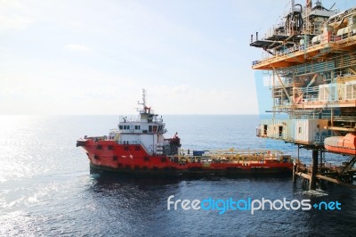 Supply Boat Transfer Cargo To Oil And Gas Industry Stock Photo