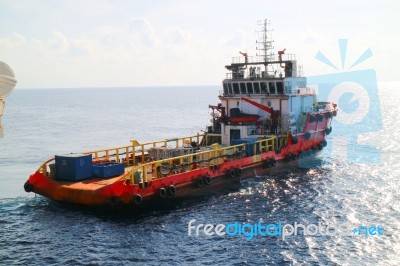 Supply Boat Transfer Cargo To Oil And Gas Industry Stock Photo