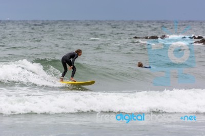 Surfing At Bude In Cornwall Stock Photo