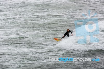 Surfing In Cornwall Stock Photo