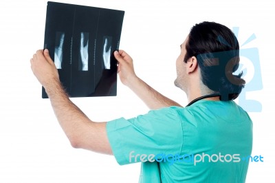 Surgeon Examining The X-ray Report Stock Photo