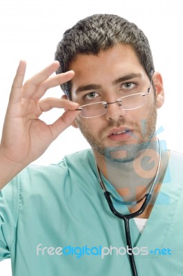 Surgeon Holding Spectacles Stock Photo