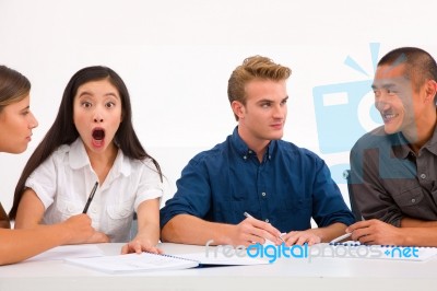 Surprised Businesswoman With Her Colleagues Workplace Stock Photo