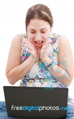 Surprised Girl Looking In Laptop Stock Photo