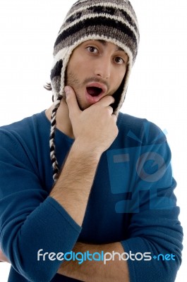 Surprised Man Wearing Woollen Hat Stock Photo