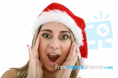 Surprised Woman In Santa Hat Stock Photo