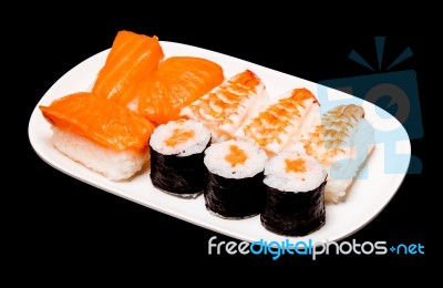 Sushi In White Plate On Black Background Stock Photo