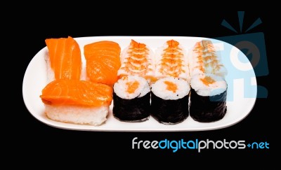 Sushi In White Plate On Black Background Stock Photo