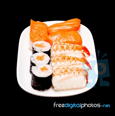 Sushi In White Plate On Black Background Stock Photo