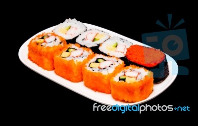 Sushi In White Plate On Black Background Stock Photo