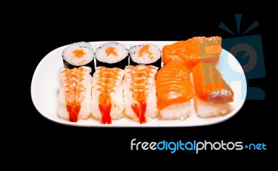 Sushi In White Plate On Black Background Stock Photo